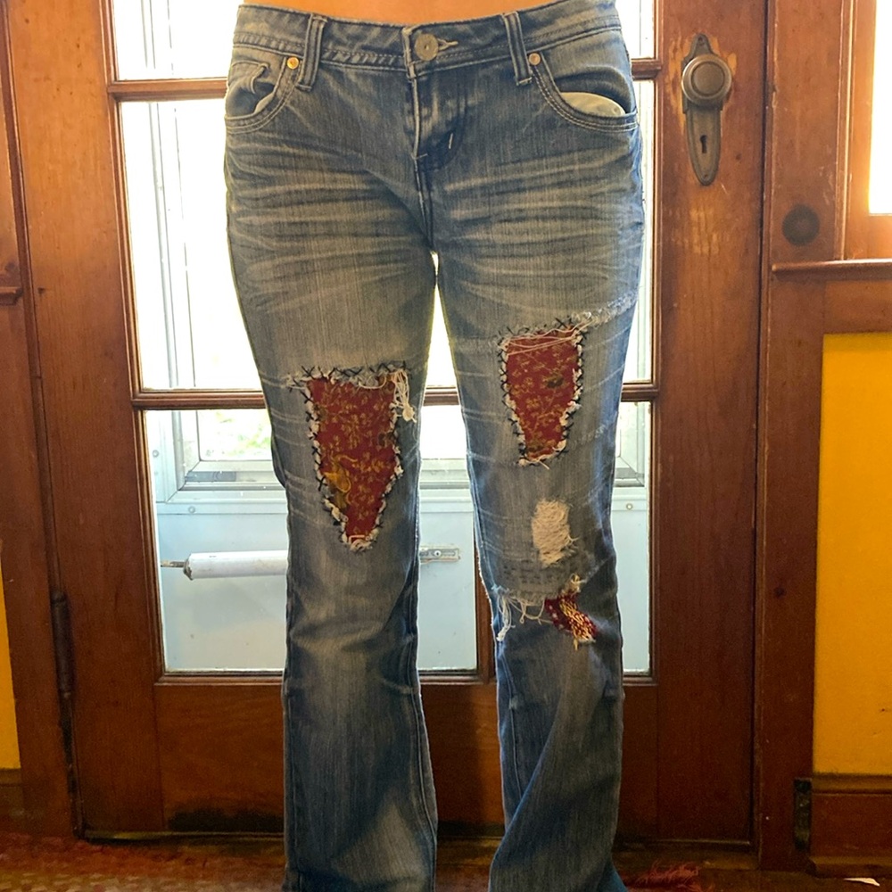 Customized patches upcycled embroidered jeans